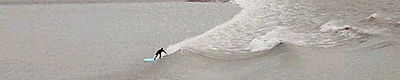 Lone surfer, Dreds, at First Parking Lot, Girdwood, Courtesy David Merrigan